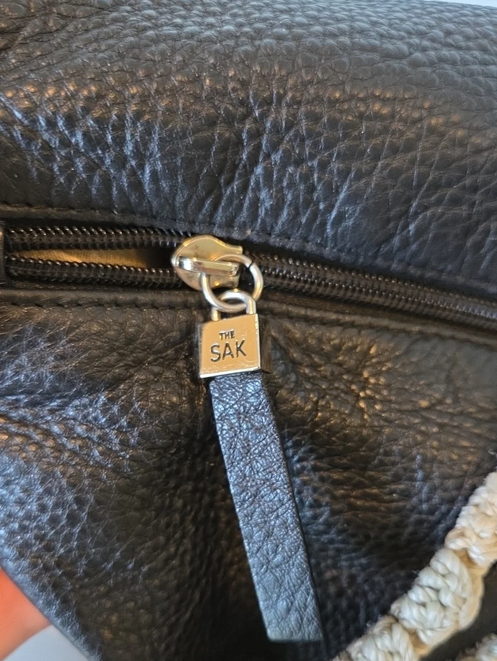 The Sak Pink Label knitted handle black leather handbag.